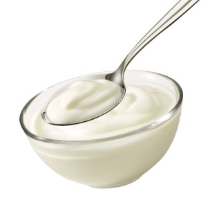 bowl and spoon with yoghurt